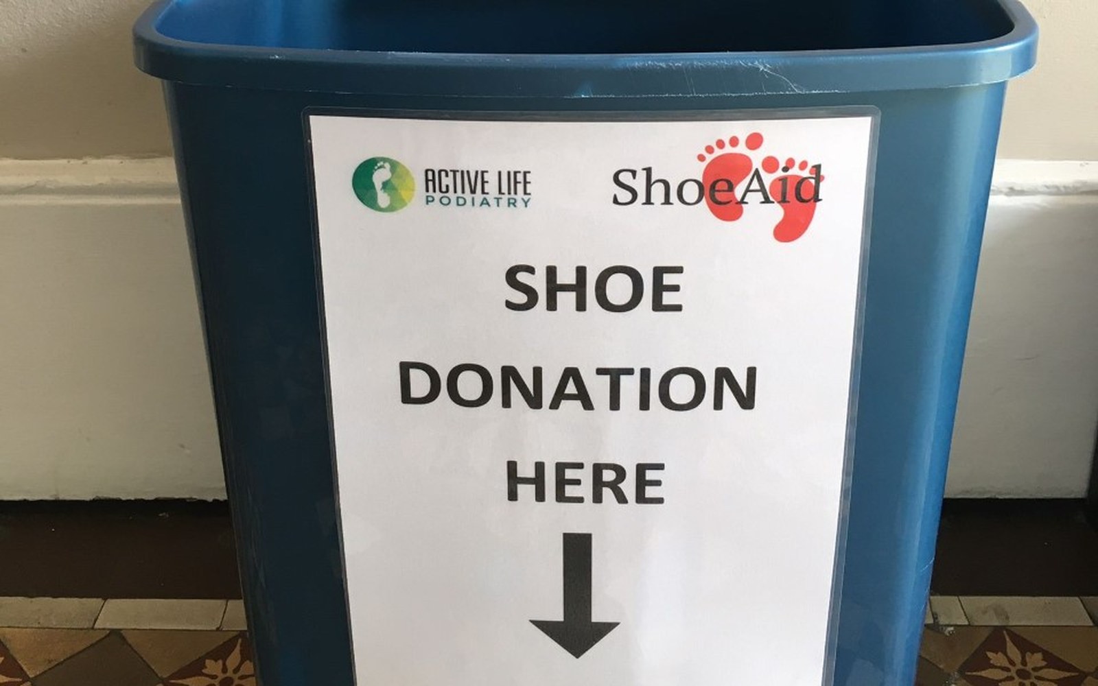 Blue Shoe Aid donation bin at Active Life Podiatry